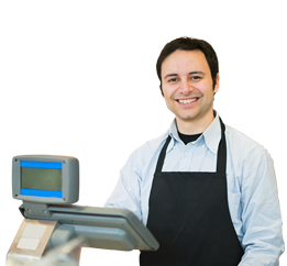 Un hombre sonriendo dentro de uno de los corresponsales bancarios